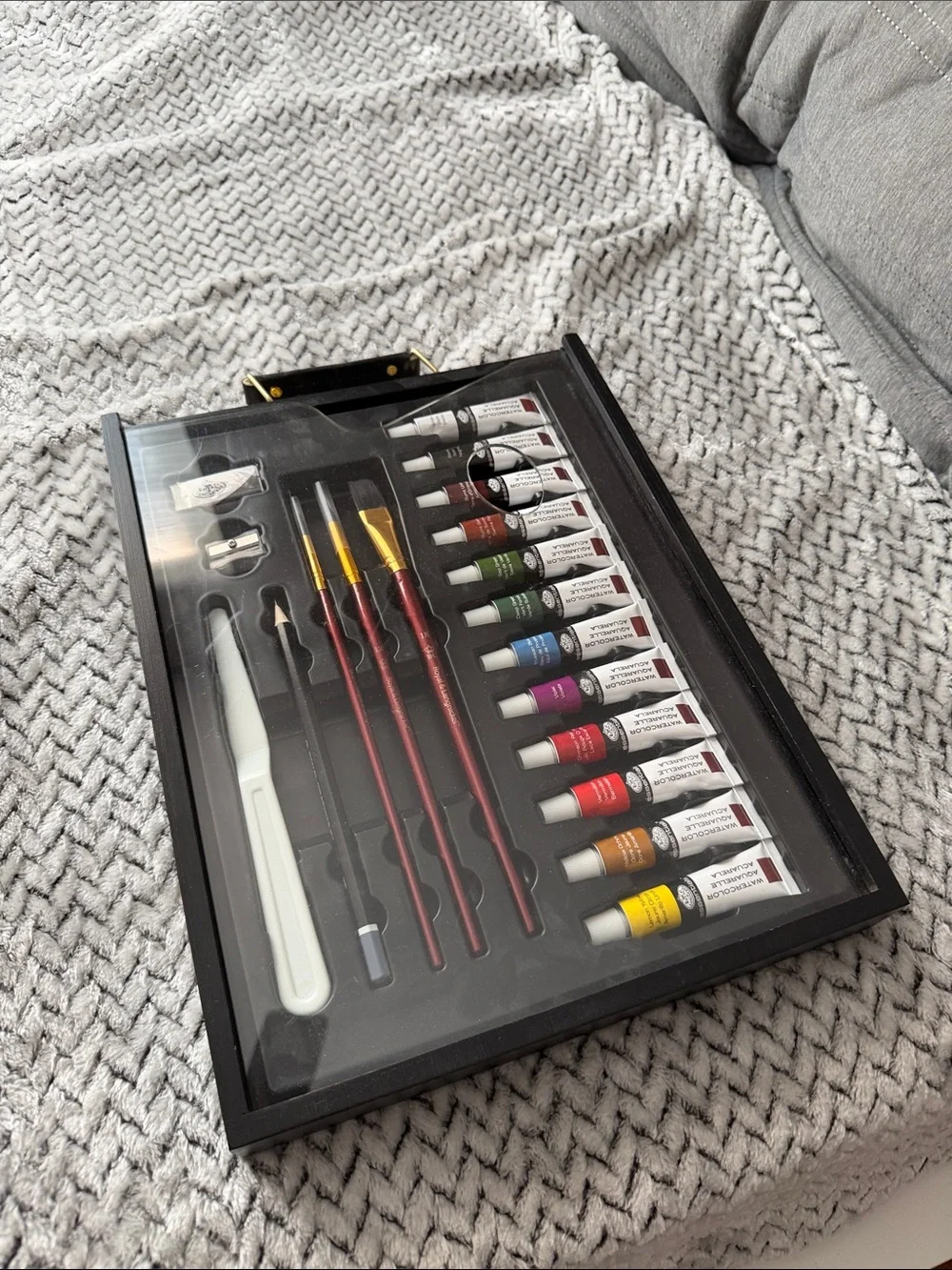Black Artist Paint Set with Assorted Colors and Brushes